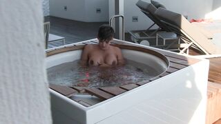 Hannah B wanking in the hot tub